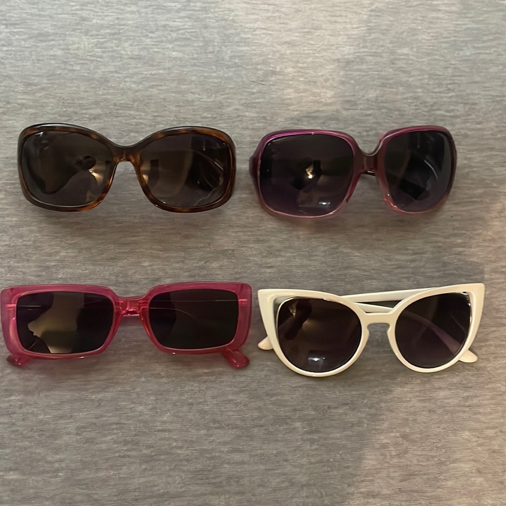 Collection- 4 pairs of affordable sunglasses  I never wore. Last pair- Roots